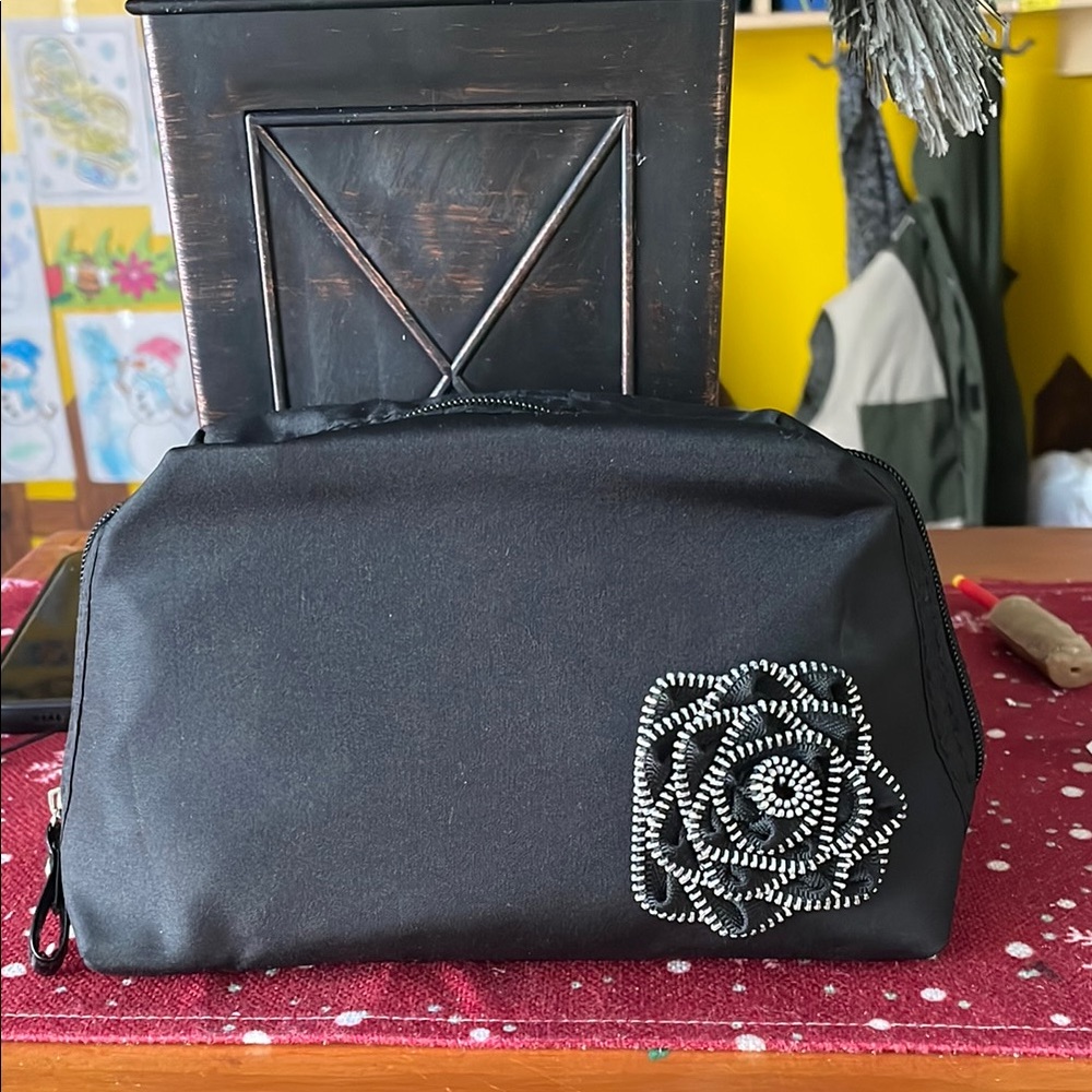 LANCÔME .Elegant Black Women's Bag with Floral Detail.